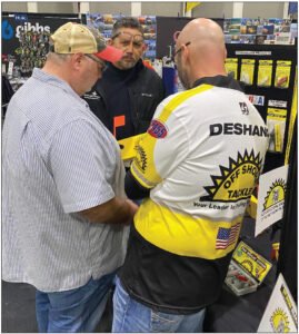 Nick DeShano of Off Shore Tackle helps these customers at a consumer sport show to get the most from their boardpurchases. Off Shore Tackle offers an extensive line of planer boards as well as planer board releases and line clips
designed to help anglers target a wealth of different species.