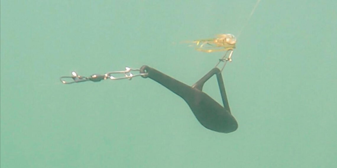 This under water photograph of a Tadpole at work shows how when weeds catch on the line, the Tadpole will still function as designed while at the same time preventing grass and weeds from sliding down and fouling the lure. Not only does the Tadpole dive, it does so more efficiently than other in-line weights.